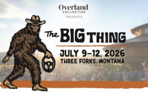 Event poster for The Big Thing: A cartoon Bigfoot holding a steering wheel with text “Overland Collective presents The BIG THING, July 9–12, 2026, Three Forks, Montana.” Crowd gathers near a rustic building in the background.
