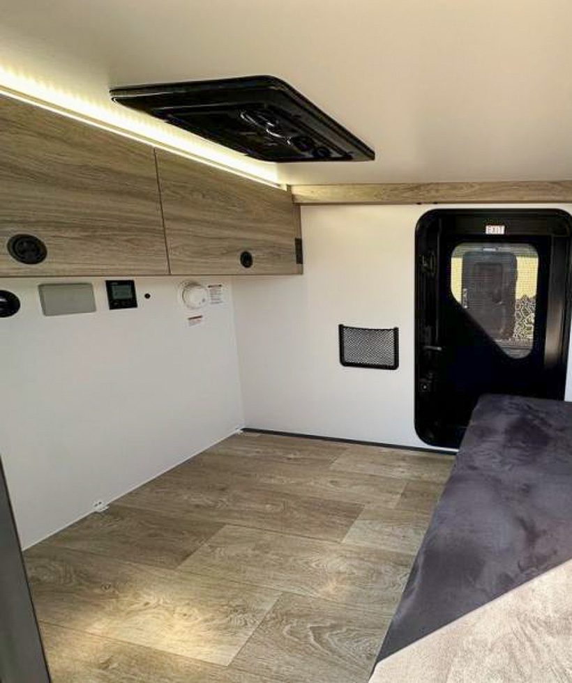 Interior cabinets in the OB120 and the sofa in seat position.