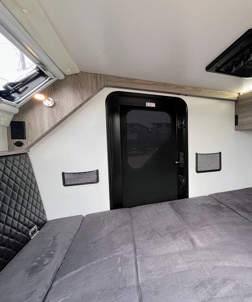 Imperial Outoodrs OB120 interior side picture of the sofa in bed position.