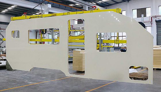 Imperial Outdoors precision CNC cut one piece composite wall piece being housed with crane.