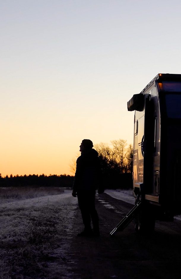 Imperial Outdoors Xplore Series man off grid camping viewing the sunrise.