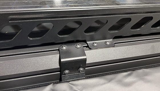 Imperial Outdoors roof rack with solar panels installed and bolted to the t-track.