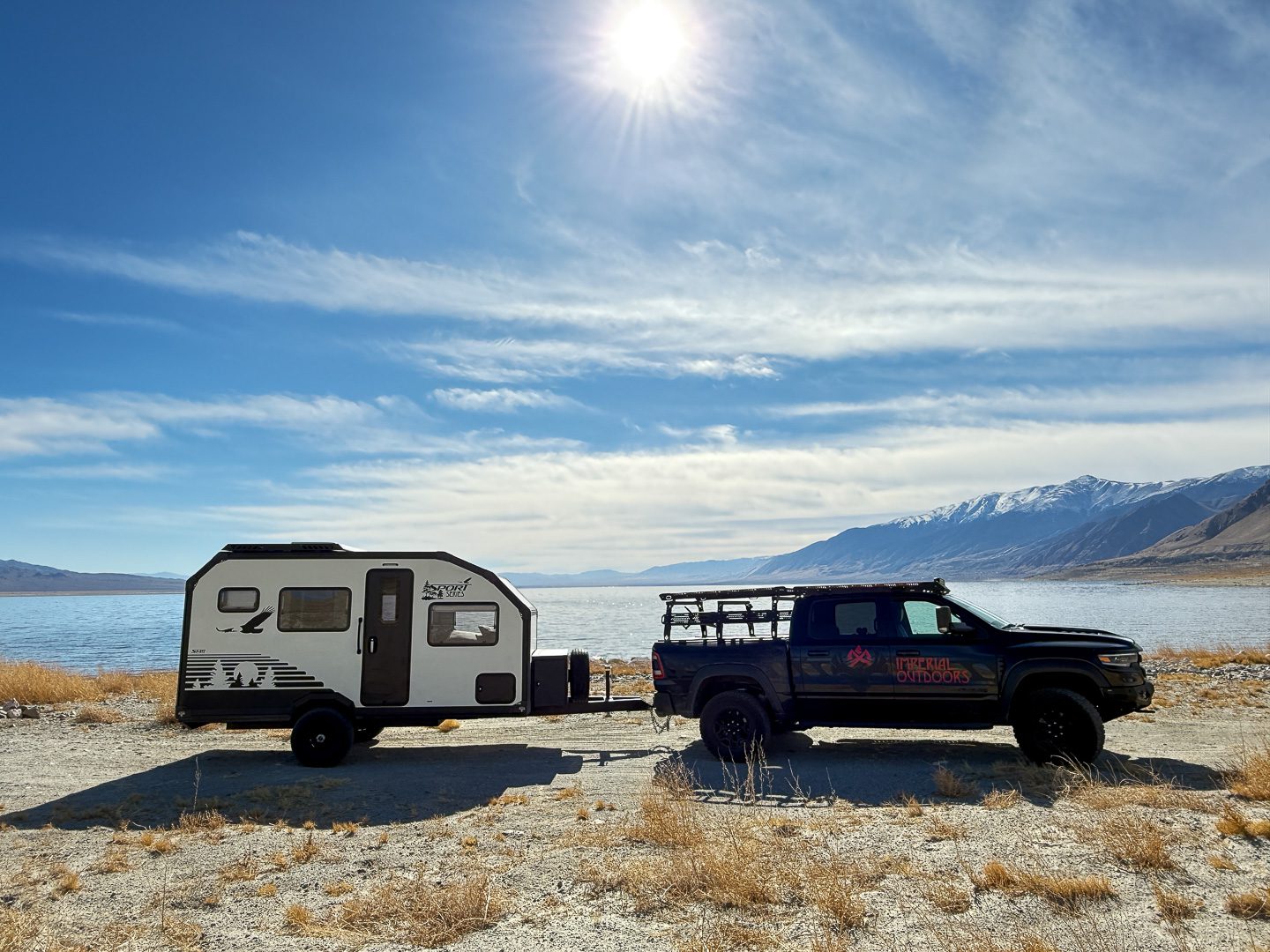 Dodge TRX pulling the S145 along the side of Montana lakes.