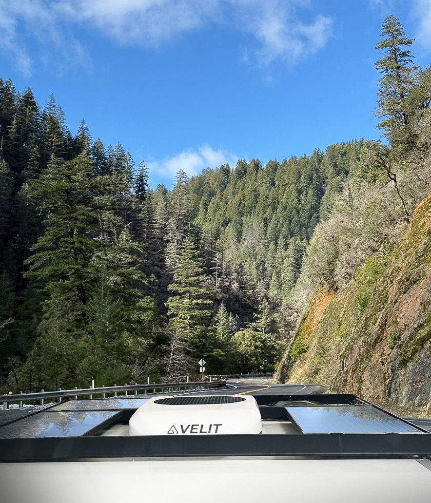The S145 in the mountains with the solar array and 12v Velit air conditioner.