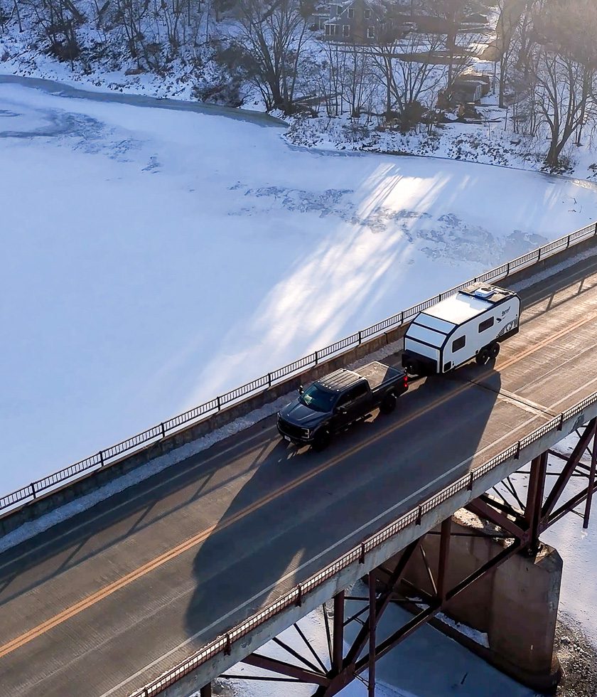 Imperial Outdoors S195 driving across the frozen river.