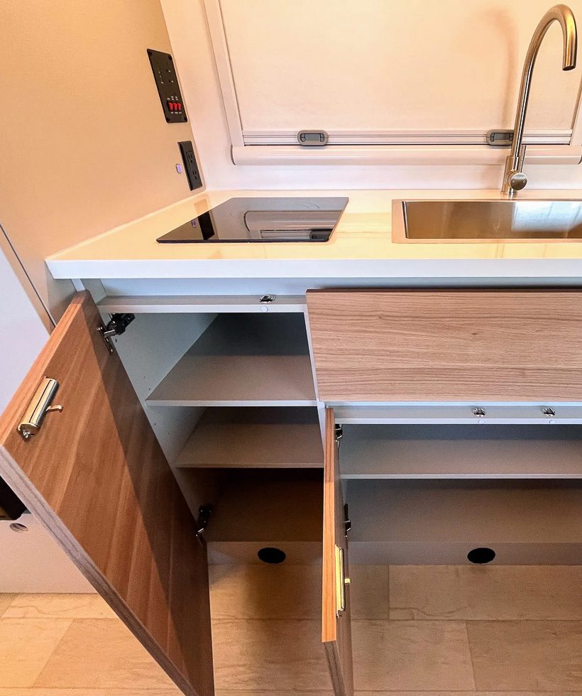 Premium kitchen cabinets all open in lower base in the S145 from Imperial Outdoors.