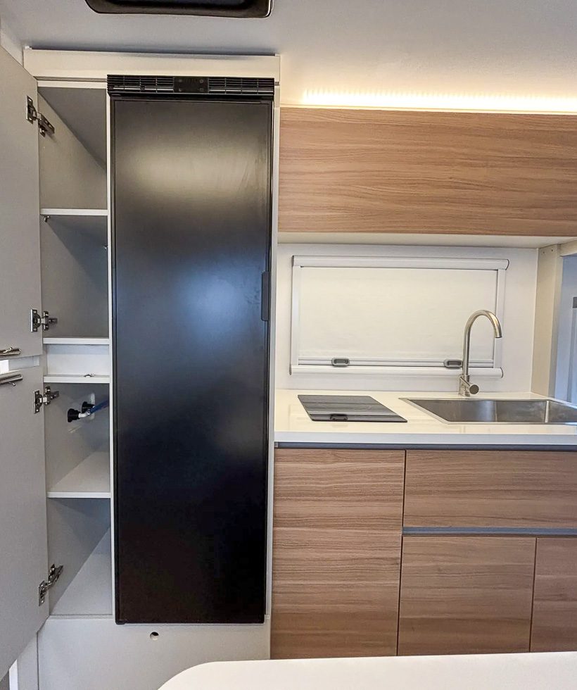Kitchen pantry next to the 12v fridge in the kitchen of the S145 from Imperial Outdoors.