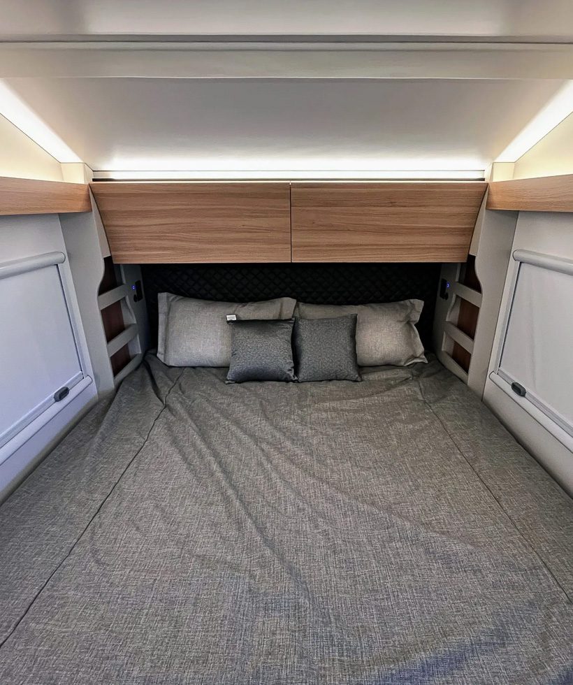 Imperial Outdoors S195 king size bed with upper cabinets above.