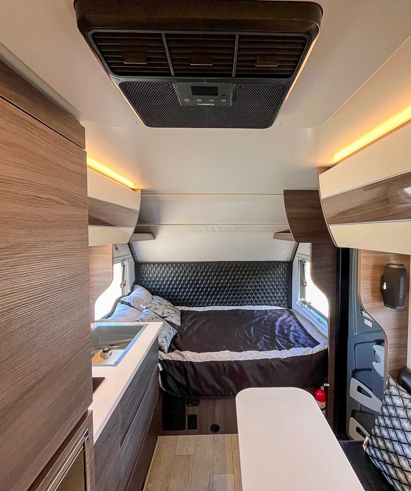 Queen size bed in the X145 off grid camper from Imperial Outdoors.