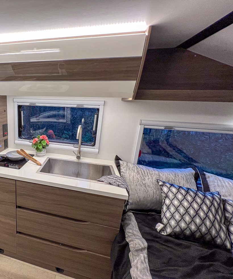 Queen bed and luxury kitchen in the X145 from Imperial Outdoors.
