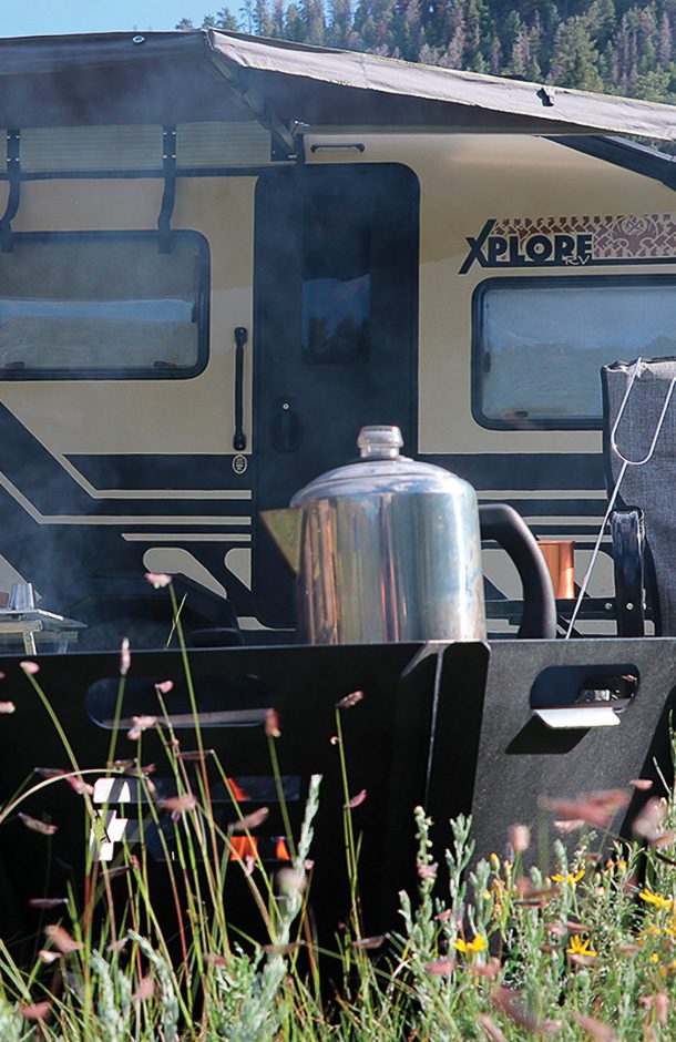 Making coffee over the fire with the X145 in the background.
