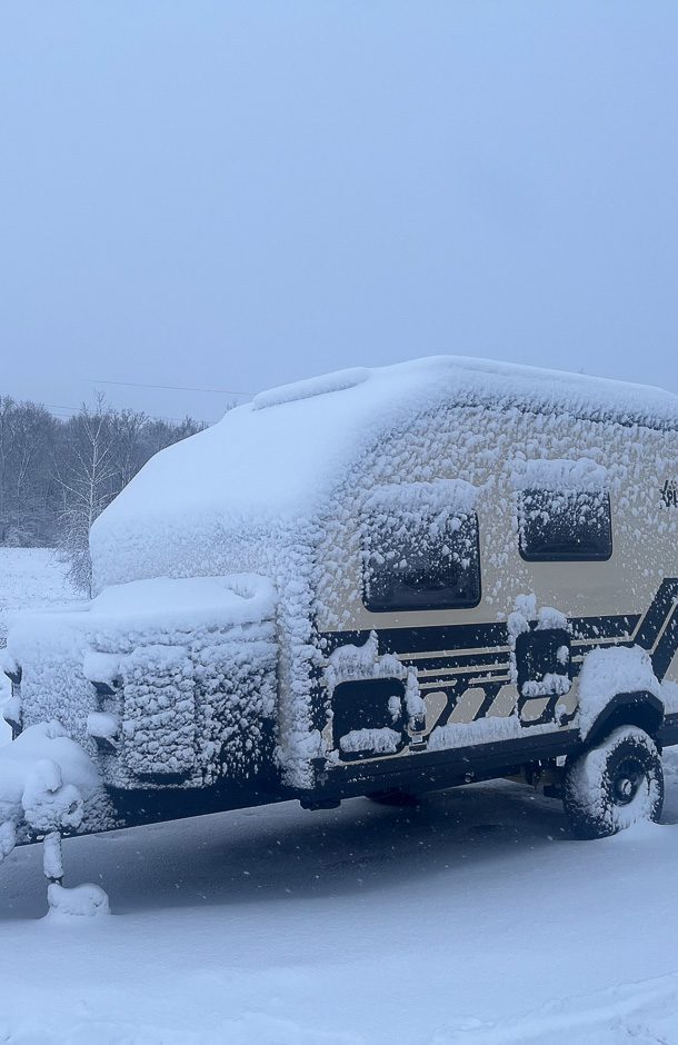 Winter camping in the X145 that is covered in ice and snow.