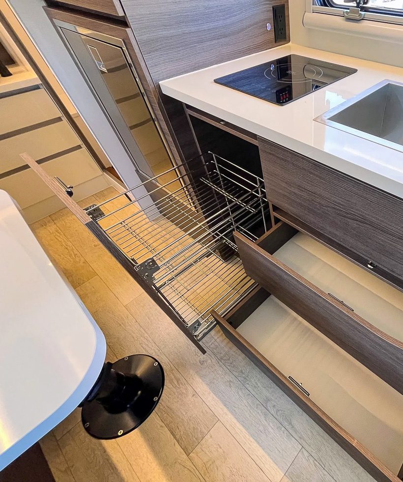 Kitchen pullout drawers and wire rack in the lower vanity of the X145 from Imperial Outdoors.
