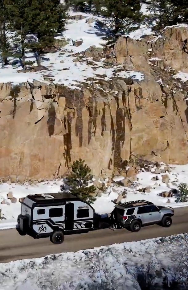 Toyota 4runner pulling the X145 along the rocky cliff terrain in the Rocky Mountains of Colorado.