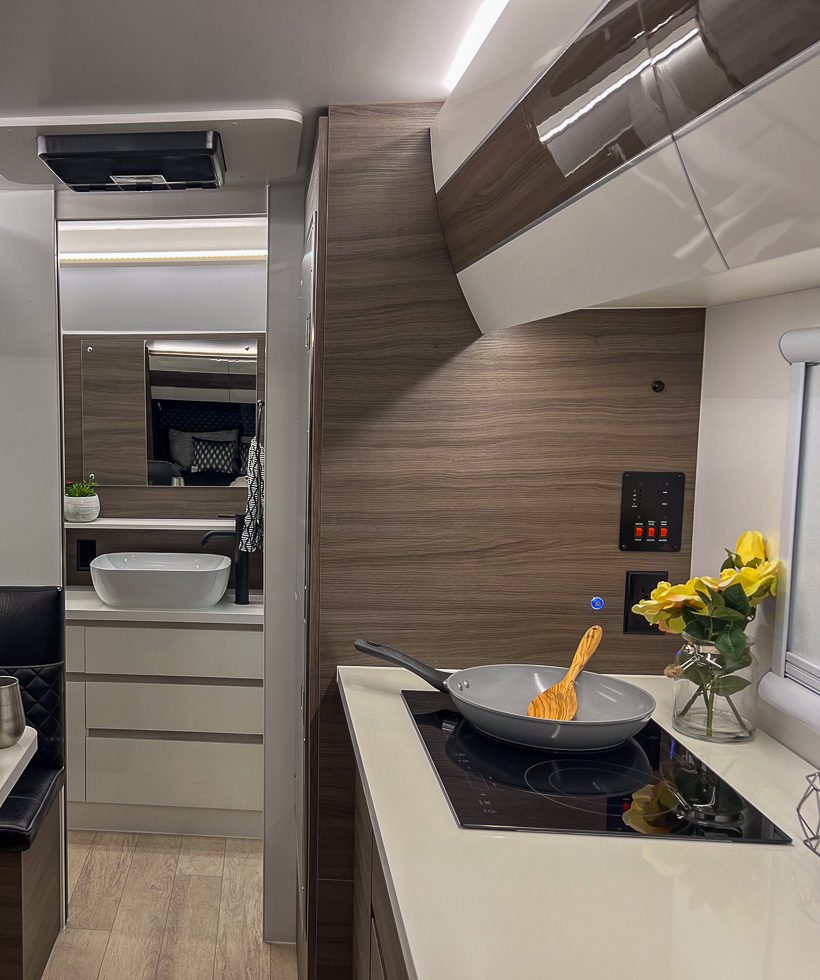 Spacious kitchen and bathroom in the Imperial Outdoors Xplore Series X195 off grid trailer.