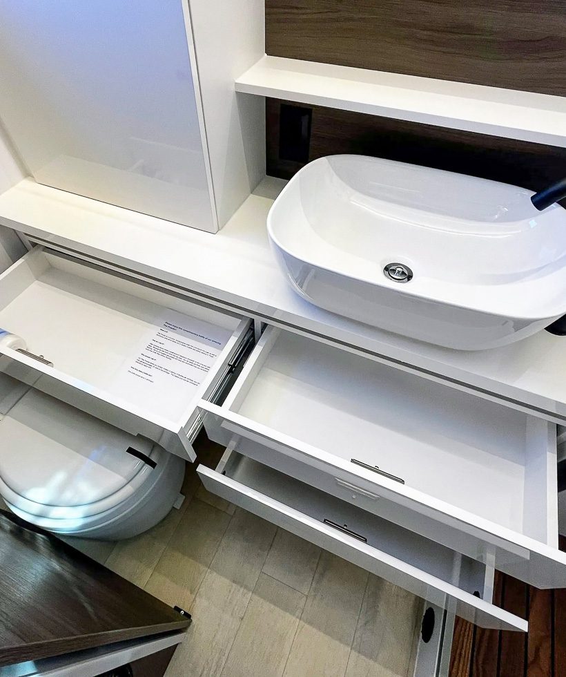 Pull out vanity lower drawers, and porcelain bathroom sink in the X145.