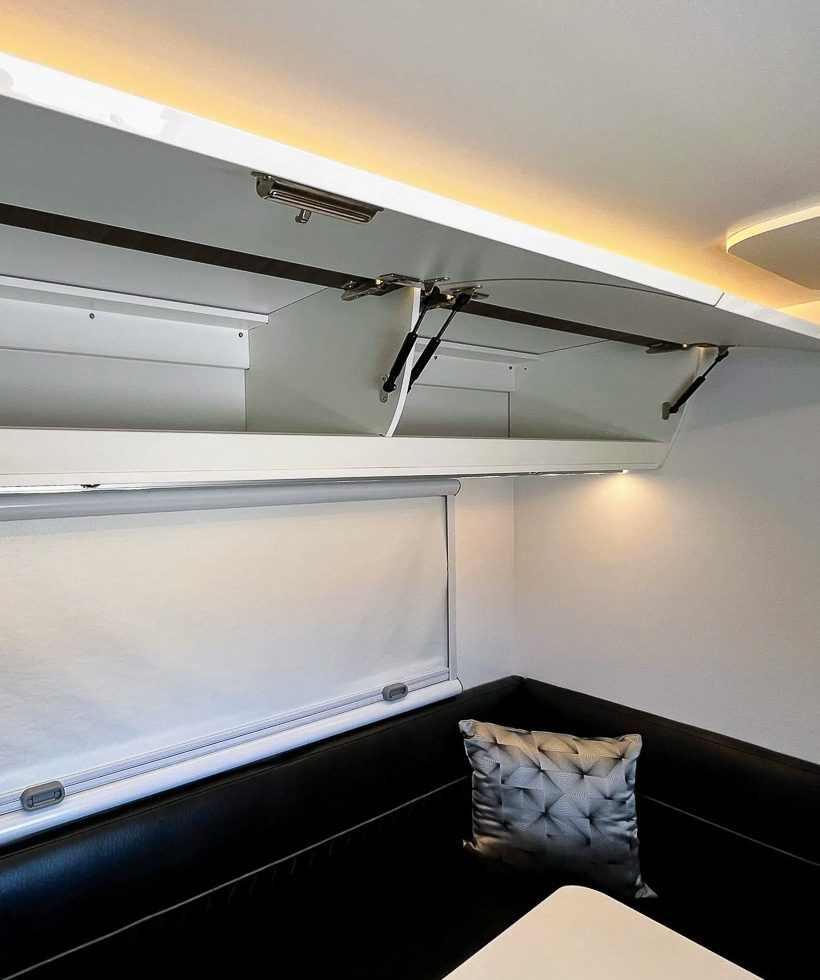 Premium space on the upper cabinets above the dinette on the Imperial Outdoors X195.