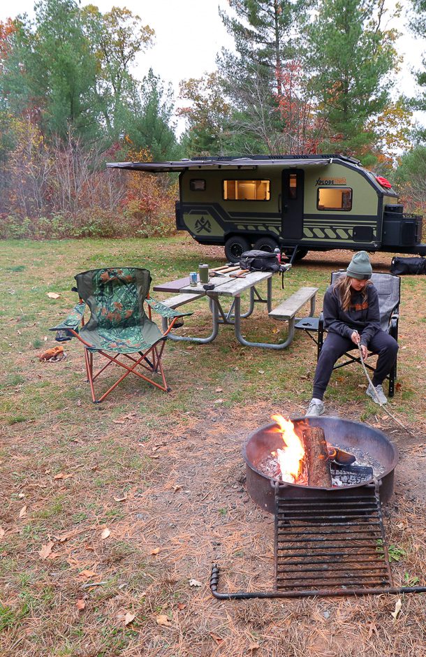 Imperial Outdoors at a quiet campsite next to camp fire.