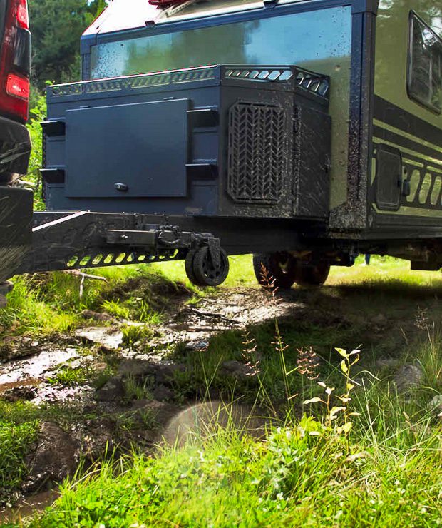 Imperial Outdoors Xplore Series X195 off road camper on a rough muddy trail in the mountains of Colorado.