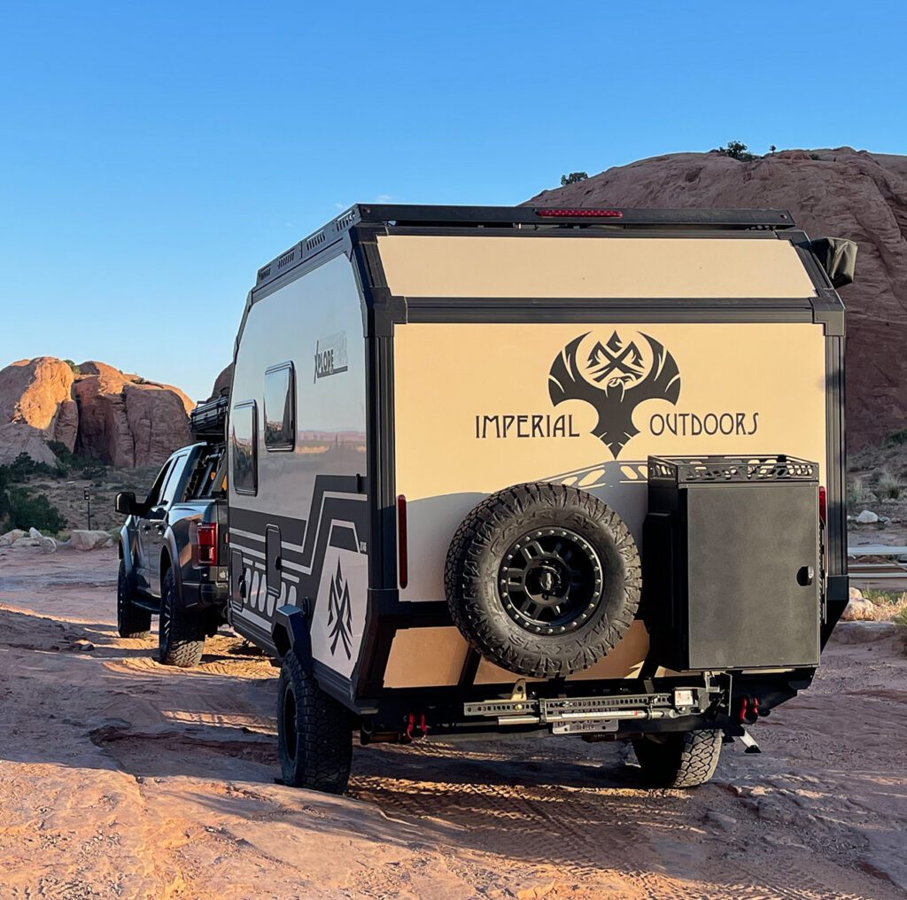 Imperial Outdoors Xplore Series X145 driving on a off-road trail in Moab Utah.