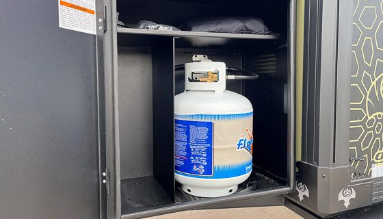 Single twenty pound propane tank installed on front box of the OB120 from Imperial Outdoors.