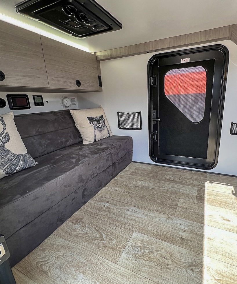 The bed of the OB120 from Imperial Outdoors turns into a couch for sitting.