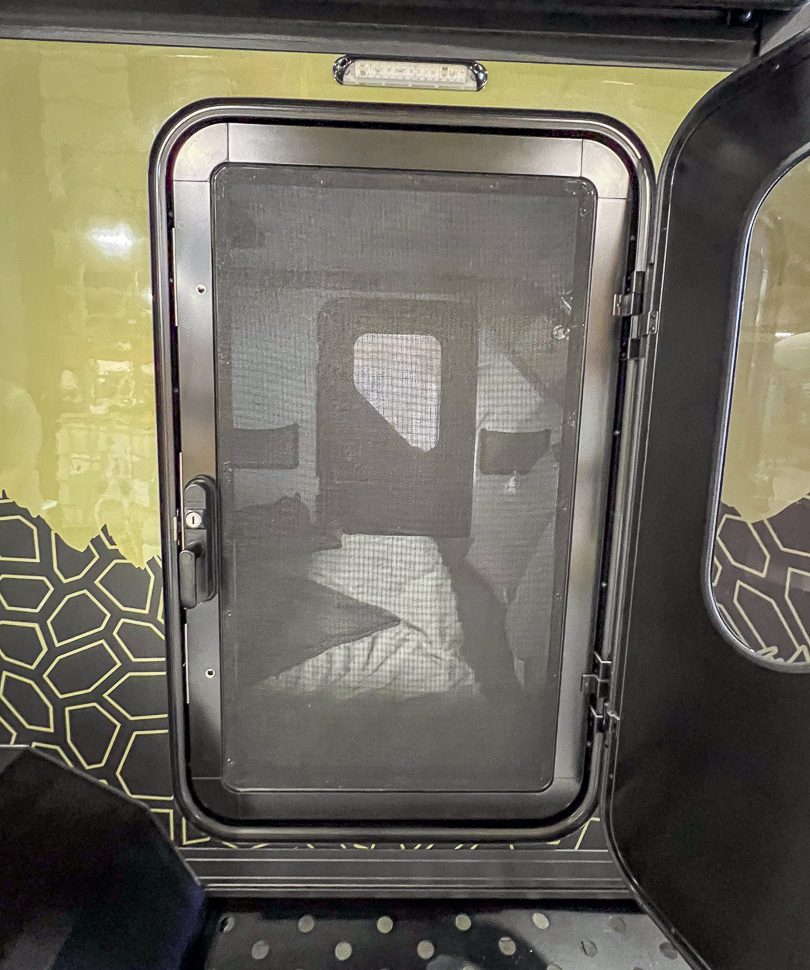 Sturdy entry screen door on the Imperial Outdoors Outback Series OB120.