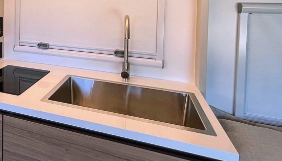 Deep stainless kitchen sink in the S145 off grid camper.