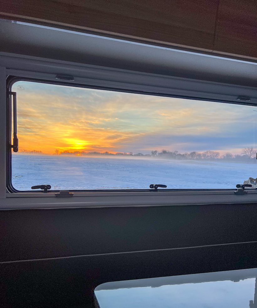 Waking up to a cold winter sunrise morning in an Imperial Outdoors Sport Series off grid camper.
