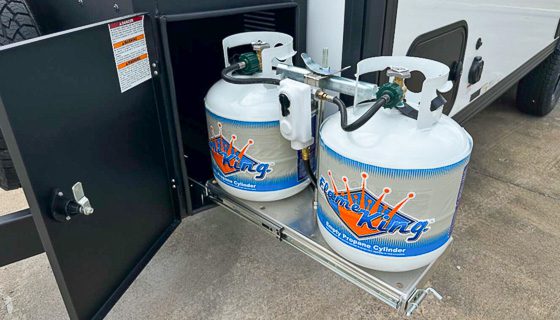 Dual propane tanks on a slide out tray in the front box of the Sport Series from Imperial Outdoors.
