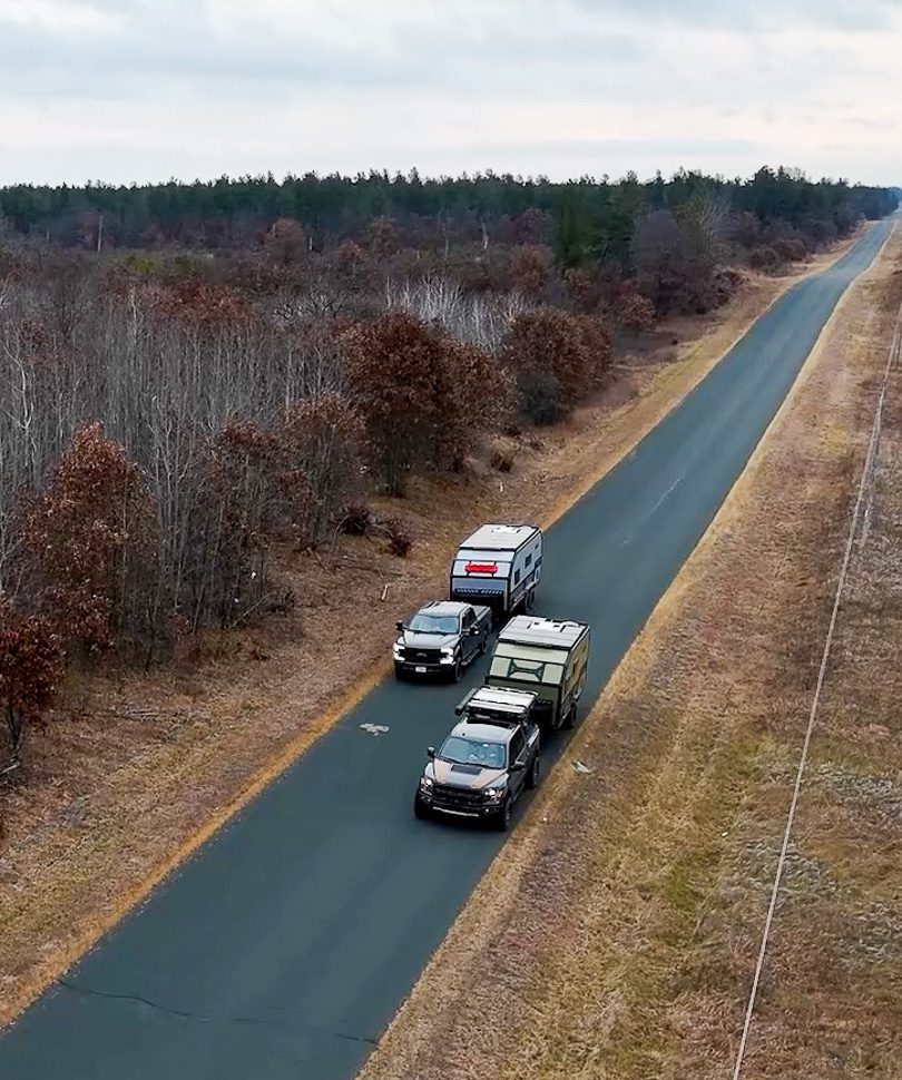 Imperial Outdoors Xplore Series trailers on country highway side by side.