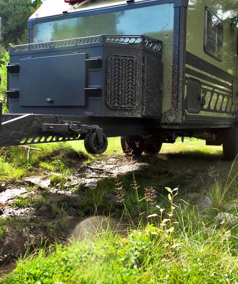 Imperial Outdoors Xplore Series with high ground clearance going off road clearing obstacles on a muddy trail.