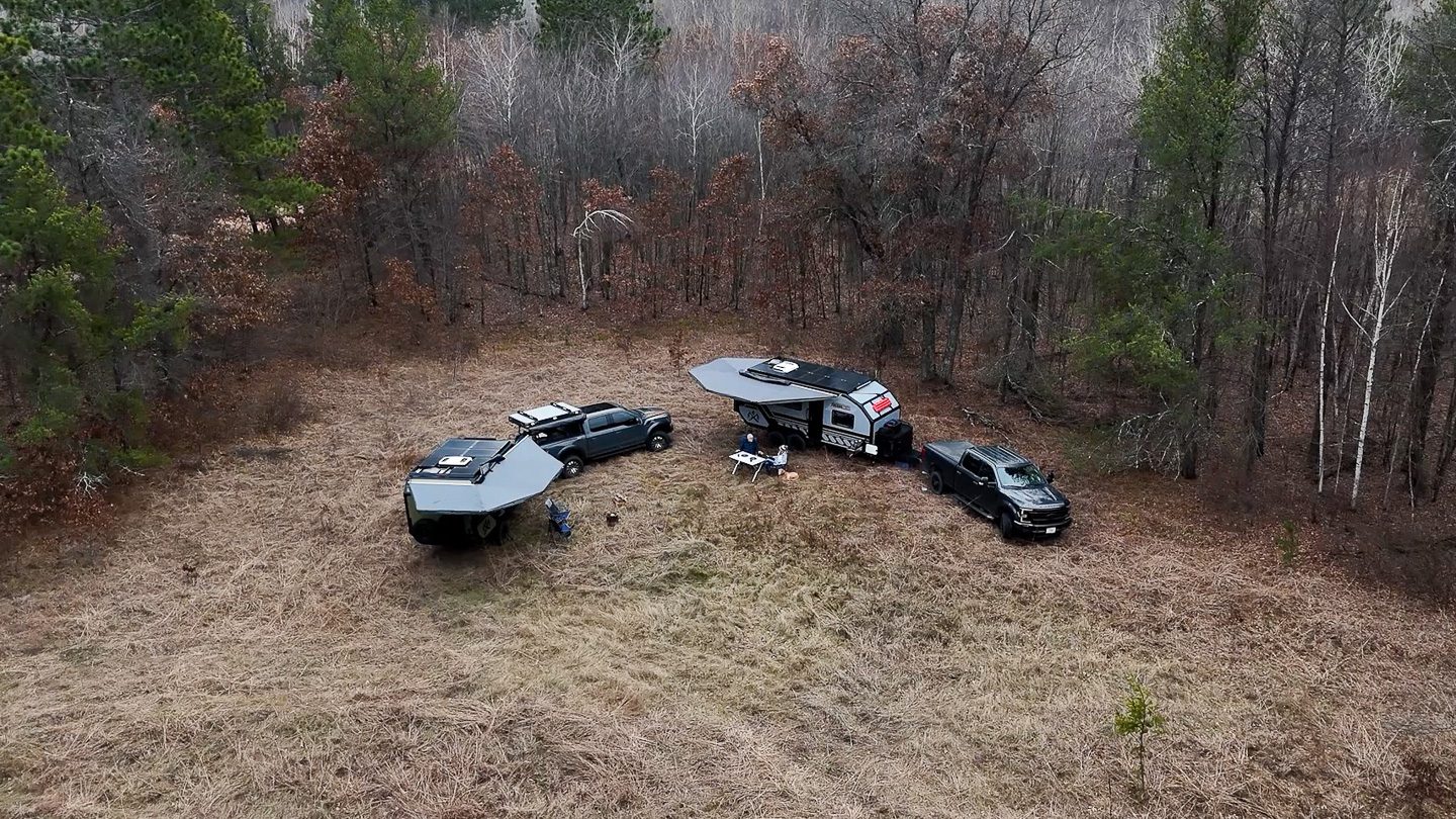 A couple in an Imperial Outdoors Xplore Series campers, in remote boon docking campsite in Wisconsin.
