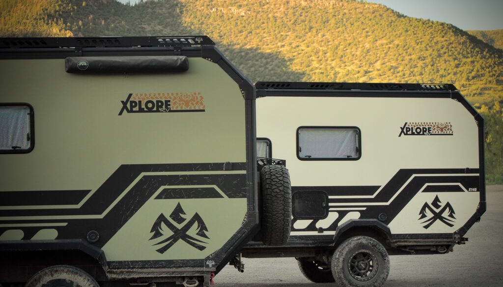 Imperial Outdoors Xplore Series models, X195 and X145 camping next to each other in the mountains.